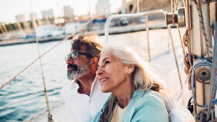 Portrait of a senior couple enjoying cruising on their yacht.