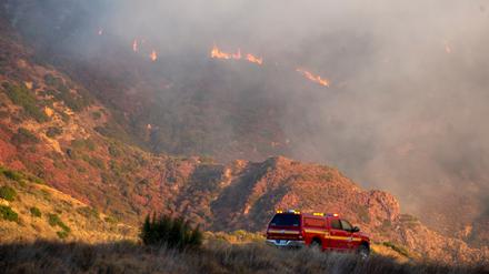 A fire services vehicle is seen as the Franklin Fire burns in Malibu, California, U.S., December 10, 2024. REUTERS/Ringo Chiu