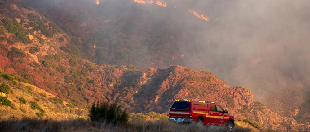 A fire services vehicle is seen as the Franklin Fire burns in Malibu, California, U.S., December 10, 2024. REUTERS/Ringo Chiu