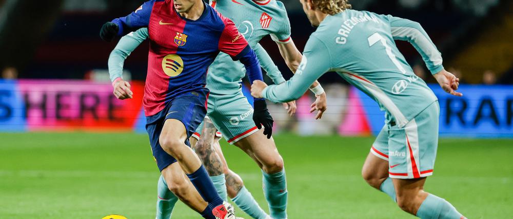 Barcelonas Torschütze Petri (links) war von Atlético oft nicht zu stoppen