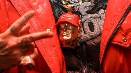 Detail shot of a guest wearing an accessory depicting U.S. President-elect Donald Trump at the Power 30 Awards, an inauguration party sponsored by TikTok for influencers who supported him, in Washington, D.C., U.S., January 19, 2025.  REUTERS/Kevin Mohatt