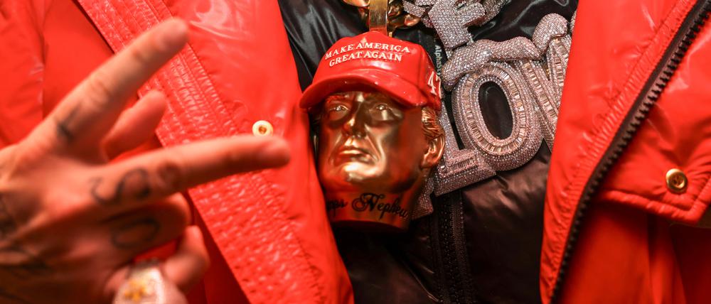 Detail shot of a guest wearing an accessory depicting U.S. President-elect Donald Trump at the Power 30 Awards, an inauguration party sponsored by TikTok for influencers who supported him, in Washington, D.C., U.S., January 19, 2025. REUTERS/Kevin Mohatt