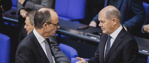 Unions-Fraktionschef Friedrich Merz und Bundeskanzler Olaf Scholz bei einer Sitzung des Deutschen Bundestages.