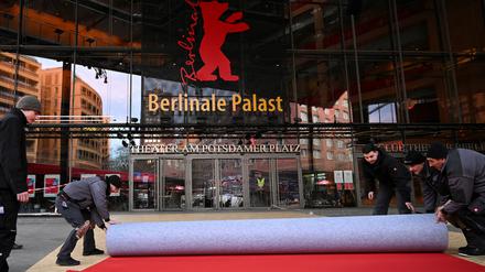 Workers lay the red carpet at the venue Berlinale Palast for the upcoming 75th Berlinale International Film Festival in Berlin, Germany February 11, 2025. REUTERS/Annegret Hilse