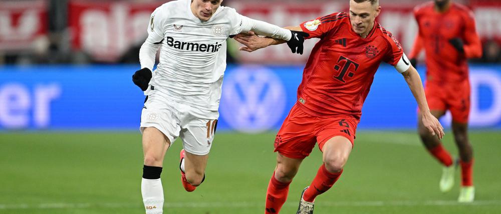 Am Samstag Gegner - irgendwann auch gemeinsam im Verein? Leverkusens Florian Wirtz (l) und Bayerns Joshua Kimmich.