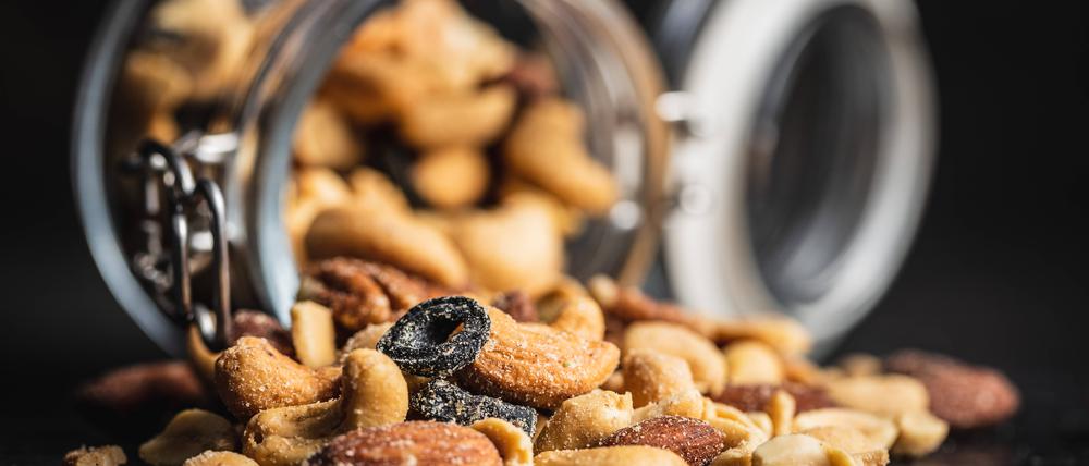 Mix of salted nuts. Mix of salted nuts on black table. Copyright: xZoonar.com/JIRIxHERAx 16984297