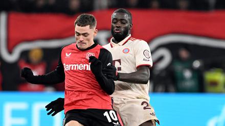 Florian Wirtz (links) und Bayerns Dayot Upamecano treffen auch in der Champions League aufeinander. 