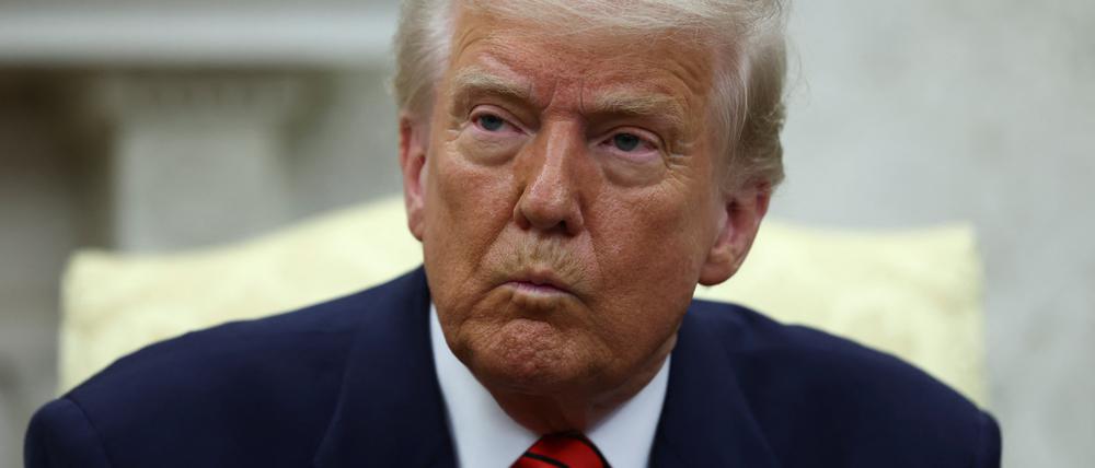 U.S. President Donald Trump reacts as he meets NATO Secretary General Mark Rutte (not pictured), in the Oval Office at the White House in Washington, D.C., U.S., March 13, 2025. REUTERS/Evelyn Hockstein