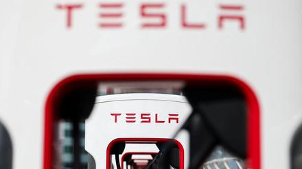 The logo of Tesla is pictured at a Tesla Super Charging station in Saint-Herblain near Nantes, France, March 27, 2025. REUTERS/Stephane Mahe