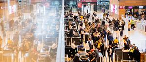 Passagiere stehen am Flughafen Berlin Brandenburg.