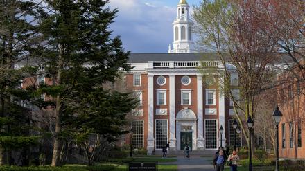 FILE PHOTO: People walk on the Business School campus of Harvard University in Cambridge, Massachusetts, U.S., April 15, 2025.   REUTERS/Faith Ninivaggi//File Photo