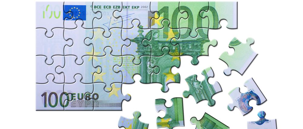 100-Euroschein als Puzzle. 