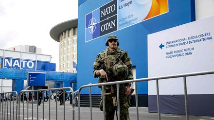 A soldier stands outside the building where is held the meetings of the two-day NATO's Heads of State and Government summit in The Hague on June 24, 2025. (Photo by Sem van der Wal / ANP / AFP) / Netherlands OUT