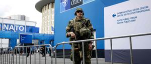 A soldier stands outside the building where is held the meetings of the two-day NATO's Heads of State and Government summit in The Hague on June 24, 2025. (Photo by Sem van der Wal / ANP / AFP) / Netherlands OUT