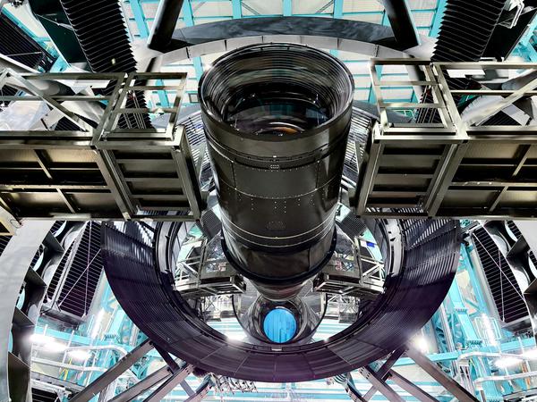 The LSST Camera is installed in the Simonyi Survey telescope. From this angle you can see the camera and the Secondary and Tertiary Mirrors. Credit: RubinObs/NSF/DOE/NOIRLab/SLAC/AURA/T. Lange