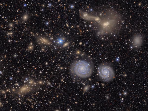 This image captures a small section of NSF–DOE Vera C. Rubin Observatory’s view of the Virgo Cluster, offering a vivid glimpse of the variety in the cosmos. Visible are two prominent spiral galaxies, three merging galaxies, galaxy groups both near and distant, stars within our own Milky Way, and much more. Credit: NSF–DOE Vera C. Rubin Observatory