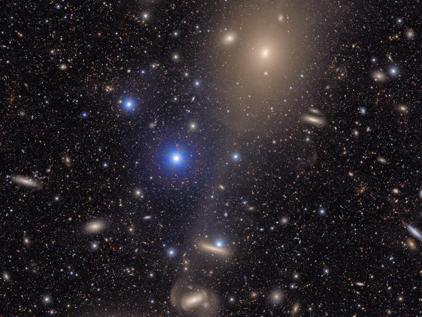 This image captures a small section of NSF–DOE Vera C. Rubin Observatory’s view of the Virgo Cluster, revealing both the grand scale and the faint details of this dynamic region of the cosmos. Bright stars from our own Milky Way shine in the foreground, while a sea of distant reddish galaxies speckle the background. Credit: NSF–DOE Vera C. Rubin Observatory