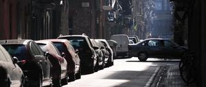 Parking chaos, Chaotic car parking scenery on the very narrow Barcelona street at early sunny morning