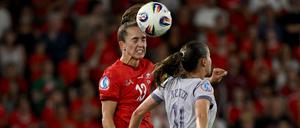 Switzerland's midfielder #13 Lia Walti heads the ball past Norway's midfielder #11 Guro Reiten during the UEFA Women's Euro 2025 Group A football match between Switzerland and Norway at the St Jakob-Park Stadium in Basel on July 2, 2025. (Photo by Miguel MEDINA / AFP)