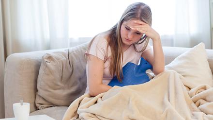 Kopfschmerzen, Gliederschmerzen und Brechreiz sind Symptome des Norovirus.