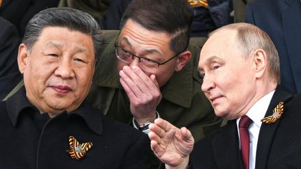 Der russische Präsident Wladimir Putin sitzt neben dem chinesischen Präsidenten Xi Jinping, während sie die jährliche Militärparade zum Tag des Sieges auf dem Roten Platz in Moskau verfolgen (Symbolbild).