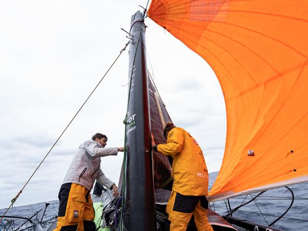 use of leftovers.  Sébastièn Simon (left) and Robert Stanjek are working on an emergency rig on “Guyot” after the racing yacht lost part of the mast in a storm. 