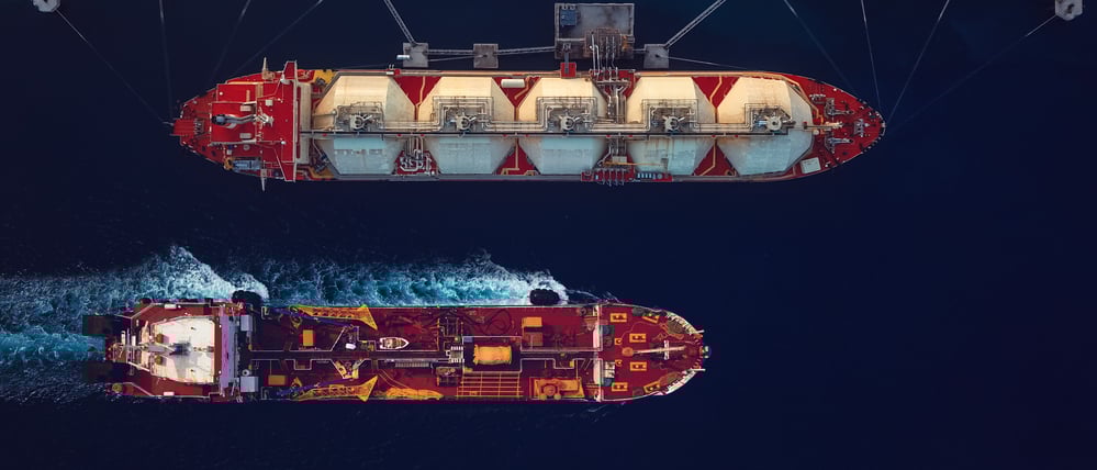 Directly above view of fuel tankers in the harbour.