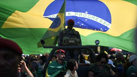 Supporters of former Brazilian President Jair Bolsonaro attend a demonstration in his favor at Copacabana Beach in Rio de Janeiro, Brazil, on August 3, 2025. (Photo by MAURO PIMENTEL / AFP)