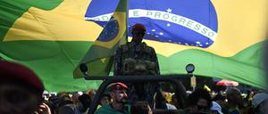 Supporters of former Brazilian President Jair Bolsonaro attend a demonstration in his favor at Copacabana Beach in Rio de Janeiro, Brazil, on August 3, 2025. (Photo by MAURO PIMENTEL / AFP)