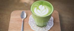green tea latte on wood background
