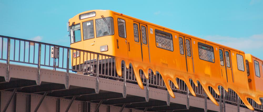 Overground subway train on a blue sky background