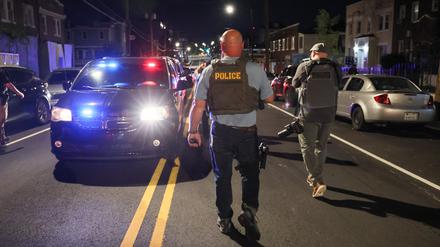 A police officer patrols on Kennedy Street NW, after U.S. President Donald Trump's announcement to deploy the National Guard and federalize the Metropolitan Police Department in Washington, D.C., U.S., August 12, 2025. REUTERS/Jessica Koscielniak