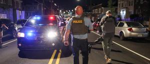 A police officer patrols on Kennedy Street NW, after U.S. President Donald Trump's announcement to deploy the National Guard and federalize the Metropolitan Police Department in Washington, D.C., U.S., August 12, 2025. REUTERS/Jessica Koscielniak