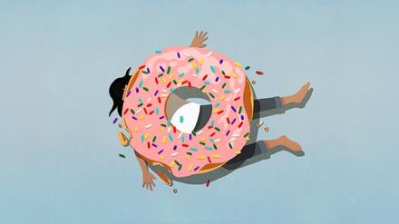 Symbolbild eines Donuts, der einen Menschen unter sich begraben hat.