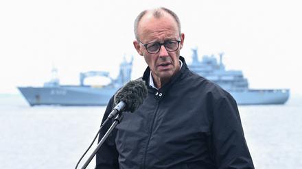 German Navy ships sail behind Chancellor Friedrich Merz as he speaks to the media, aboard the frigate Bayern (F217), during his inaugural visit to the navy, in the Baltic Sea near the Warnow shipyard, off the coast of Rostock, Germany August 28, 2025. REUTERS/Annegret Hilse