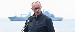 German Navy ships sail behind Chancellor Friedrich Merz as he speaks to the media, aboard the frigate Bayern (F217), during his inaugural visit to the navy, in the Baltic Sea near the Warnow shipyard, off the coast of Rostock, Germany August 28, 2025. REUTERS/Annegret Hilse