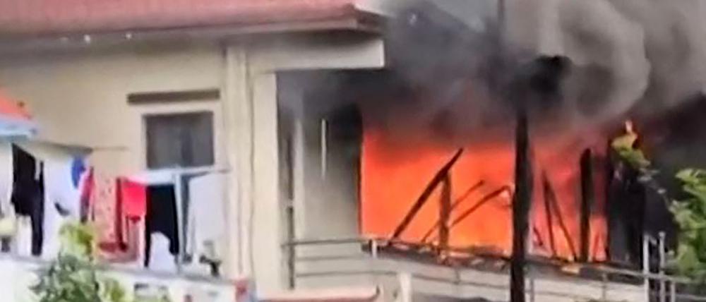 This frame grab from AFPTV video footage taken on September 9, 2025 shows smoke rising from a fire at the residence of KP Sharma Oli, who resigned after youth protesters demanded he quit as Nepal’s prime minister, in Kathmandu. Nepal’s veteran prime minister Oli resigned on September 9, a day after one of the deadliest crackdowns in years in which at least 19 people were killed. (Photo by Ujjwal Dhungana / AFPTV / AFP)