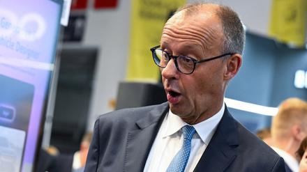German Chancellor Friedrich Merz reacts as he tours the IAA Mobility 2025 auto show in Munich, Germany, September 9, 2025. REUTERS/Angelika Warmuth