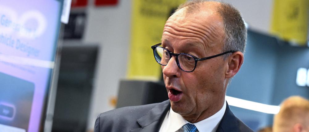 German Chancellor Friedrich Merz reacts as he tours the IAA Mobility 2025  auto show in Munich, Germany, September 9, 2025. REUTERS/Angelika Warmuth
