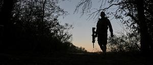 A serviceman of the 141st Separate Mechanized Brigade of the Ukrainian Armed Forces walks at a position near a front line, amid Russia’s attack on Ukraine, in Donetsk region.
