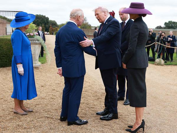 Britain's King Charles III and Britain's Queen Camilla greet US President Donald Trump and First Lady Melania Trump, accompanied by Britain's Prince William, Prince of Wales and Britain's Catherine, Princess of Wales, upon their arrival in the grounds of Windsor Castle, in Windsor, on September 17, 2025, for the start of a second State Visit. US President Donald Trump arrived in Britain for an unprecedented second State Visit, with the UK government rolling out a royal red carpet welcome to win over the mercurial leader. (Photo by Ian Vogler / POOL / AFP)