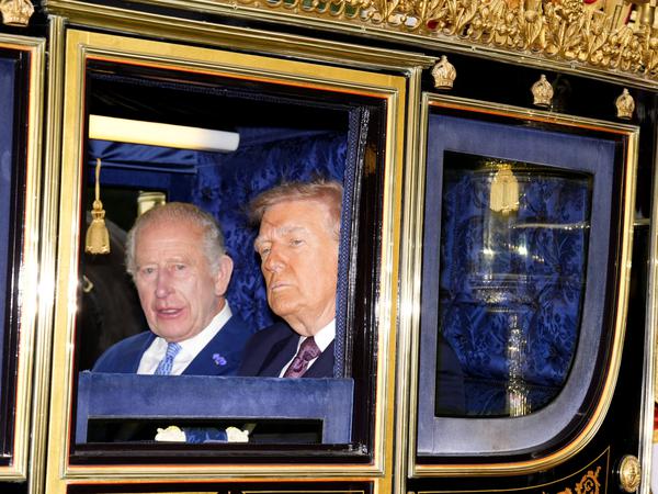 King Charles III and US President Donald Trump during the carriage procession to Windsor Castle, Berkshire, ahead of the ceremonial welcome on day one of the US President's second state visit to the UK. Picture date: Wednesday September 17, 2025.    Jordan Pettitt/Pool via REUTERS