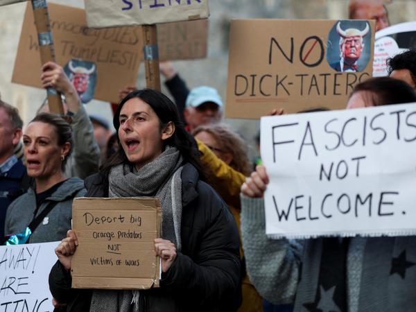SENSITIVE MATERIAL. THIS IMAGE MAY OFFEND OR DISTURB Demonstrators hold signs and placards during a "Trump Not Welcome" protest ahead of U.S. President Donald Trump and first lady Melania Trump's arrival for their state visit to the country, in Windsor, Britain, September 16, 2025. REUTERS/Hannah McKay