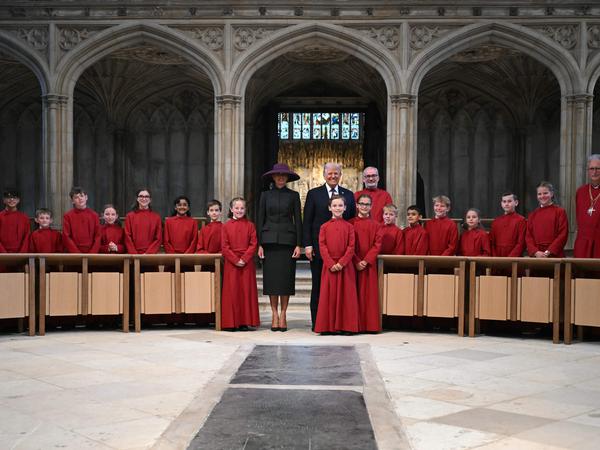 US President Donald Trump (CR) and US First Lady Melania Trump (CL) pose with young members of the choir at St George's Chapel at Windsor Castle, in Windsor, on September 17, 2025, during the US president's second State Visit. US President Donald Trump arrived in Britain for an unprecedented second State Visit, with the UK government rolling out a royal red carpet welcome to win over the mercurial leader. (Photo by ANDREW CABALLERO-REYNOLDS / POOL / AFP)