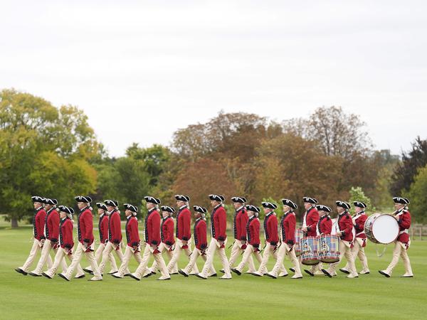 The United States Army Old Guard Fife and Drum Corps take part in a Beating Retreat military parade on the East Lawn at Windsor Castle, in Windsor, on September 17, 2025, during US President Donald Trump's second State Visit. US President Donald Trump arrived in Britain for an unprecedented second State Visit, with the UK government rolling out a royal red carpet welcome to win over the mercurial leader. (Photo by Andrew Matthews / POOL / AFP)