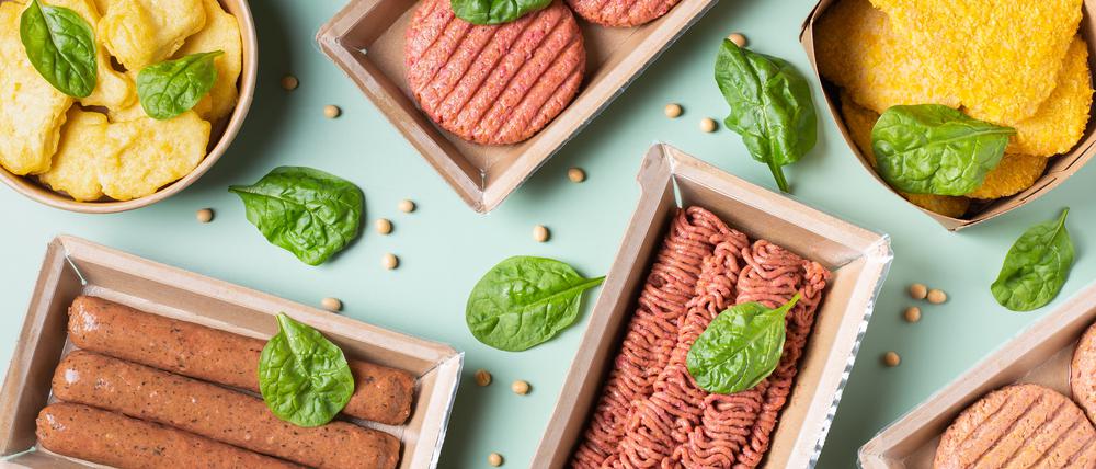 Assortment of plant based meat on a table. Food to reduce carbon footprint, sustainable consumption. View from above, flat lay food.
veggie