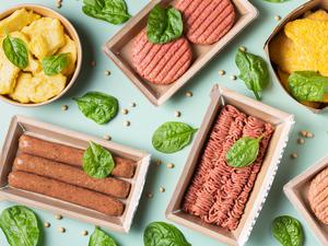 Assortment of plant based meat on a table. Food to reduce carbon footprint, sustainable consumption. View from above, flat lay food.
veggie