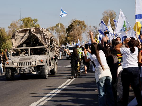 A convoy carrying released hostages, who have been held in Gaza since the deadly October 7, 2023 attack by Hamas, are expected to be released as part of a prisoner-hostage swap and a ceasefire deal between Israel and Hamas, arrive in Reim, southern Israel, October 13, 2025. REUTERS/Amir Cohen