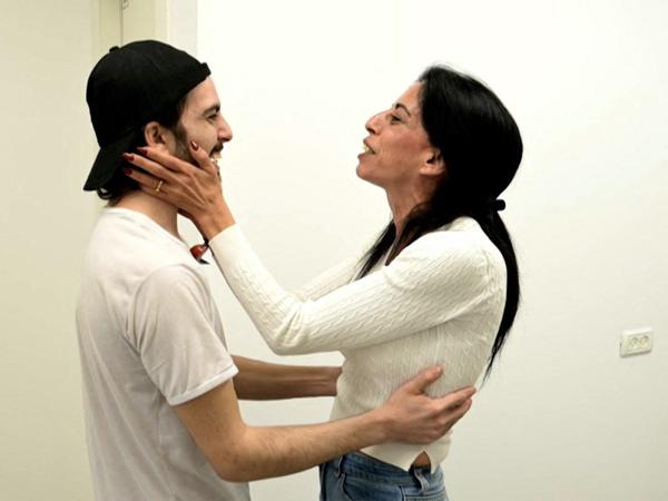 This handout picture released by the Israeli army shows released Israeli hostage Matan Zangauker (L), one of the former captives in Gaza since the 2023 October 7 attacks by Palestinian militants, being received by his mother Einav Zangauker after being handed over in a prisoner-hostage swap and a ceasefire deal between Israel and Hamas in Israel on October 13, 2025. (Photo by Israeli Army / AFP) / === RESTRICTED TO EDITORIAL USE - MANDATORY CREDIT "AFP PHOTO / Handout / Israeli Army' - NO MARKETING NO ADVERTISING CAMPAIGNS - DISTRIBUTED AS A SERVICE TO CLIENTS ==