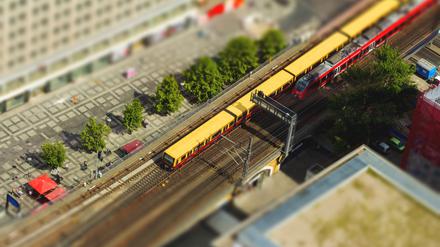 Aerial view of the S-Bahn tracks rapid train and tram train at the Alexanderplatz public square in Berlin. with tilt-shift effect.